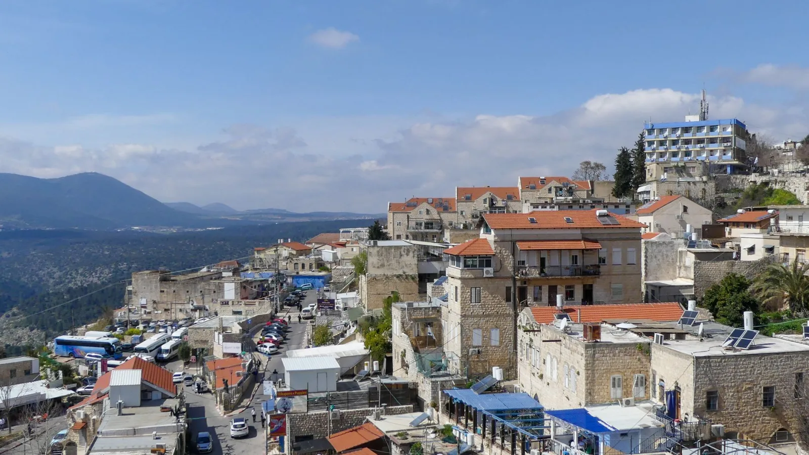 Stunning view of Safed, Israel, showcasing historic stone buildings under a clear blue sky.