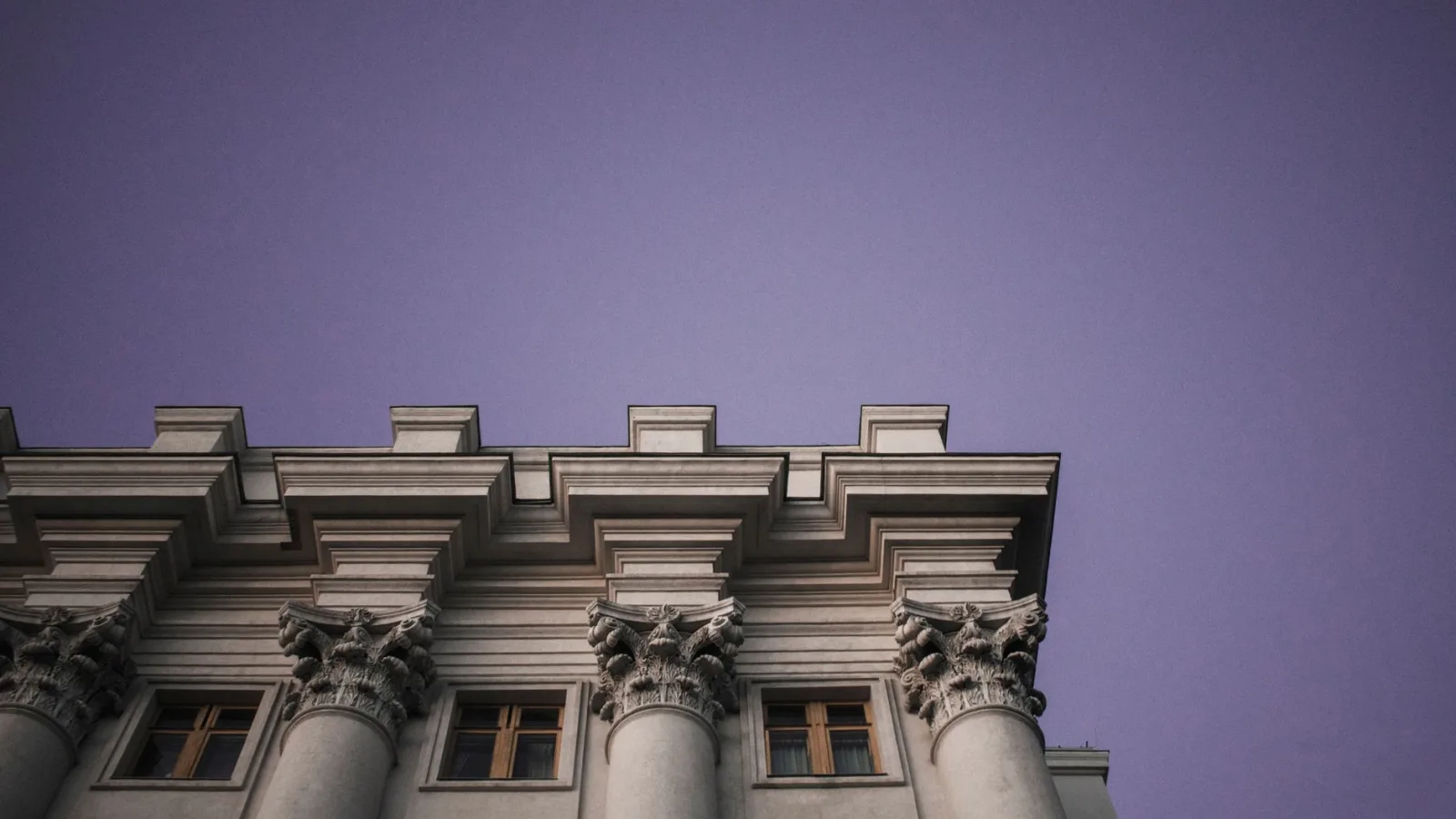 Majestic architectural columns against a twilight sky in Kyiv, Ukraine.